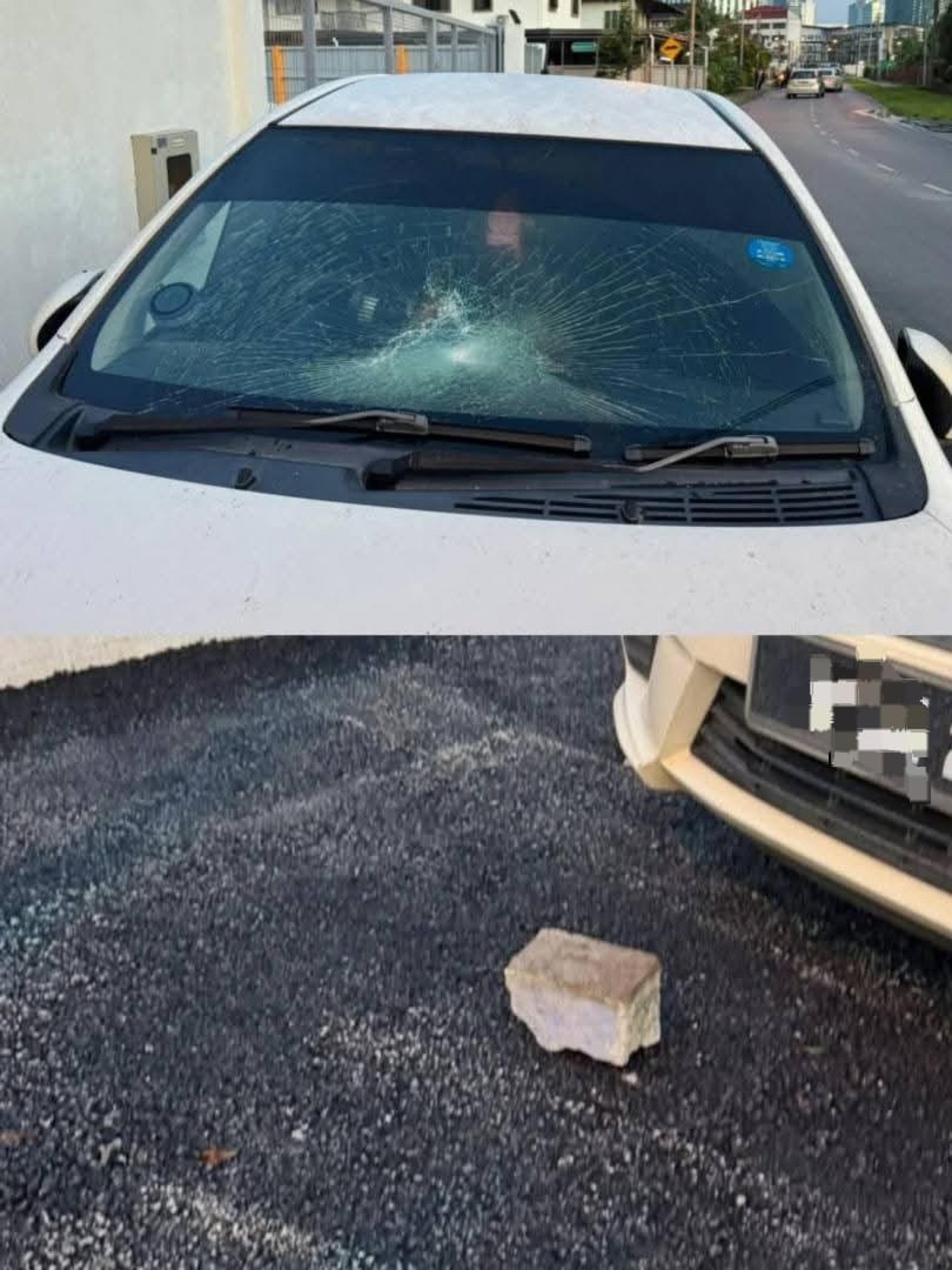 A car windscreen damaged by a stone allegedly thrown by the suspect.