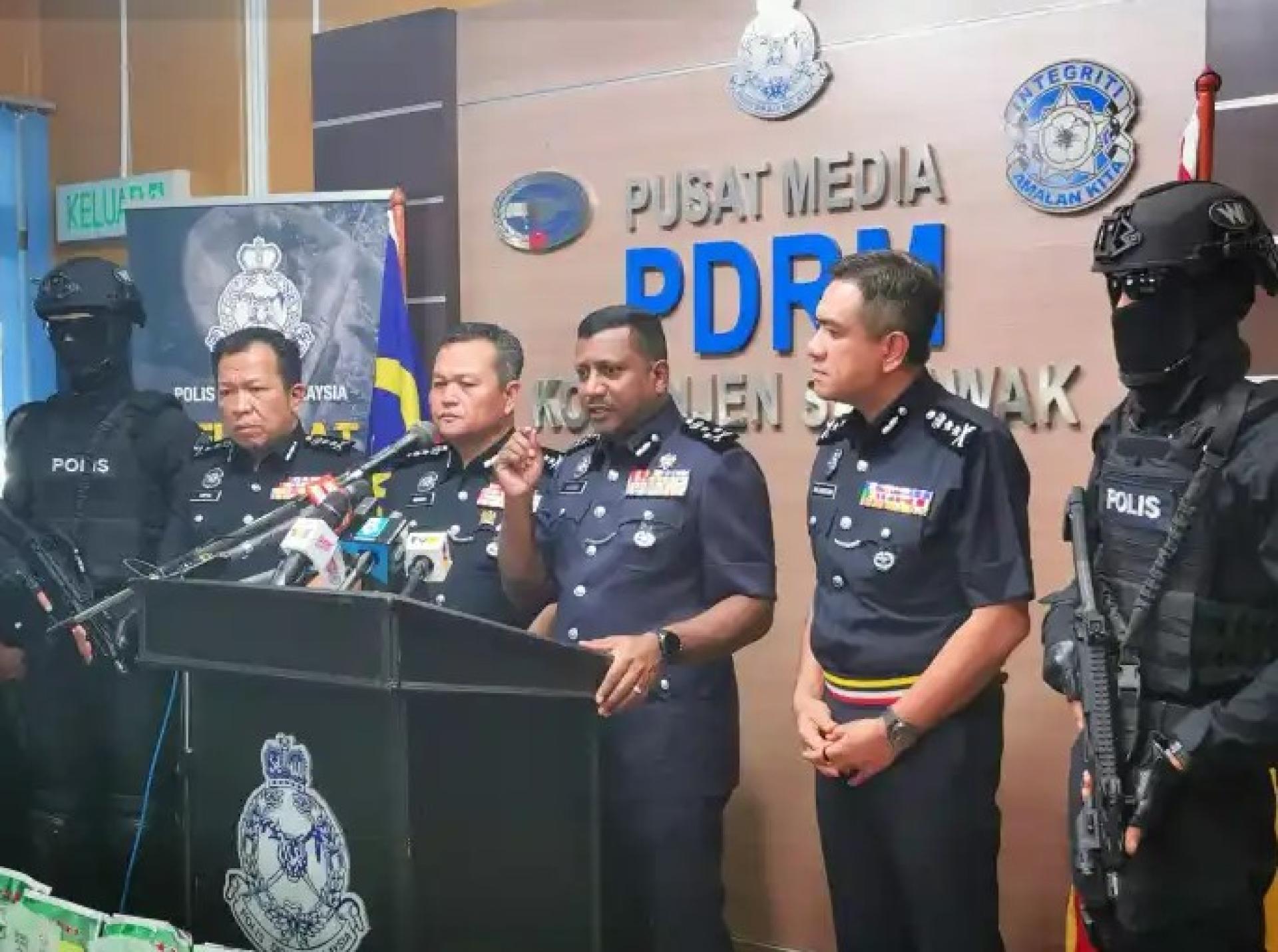 Hussein speaks during the press conference as (from second left) Saifullizan, Mancha and Mat Zani look on at Sarawak Police Headquarters in Kuching on July 28, 2025.