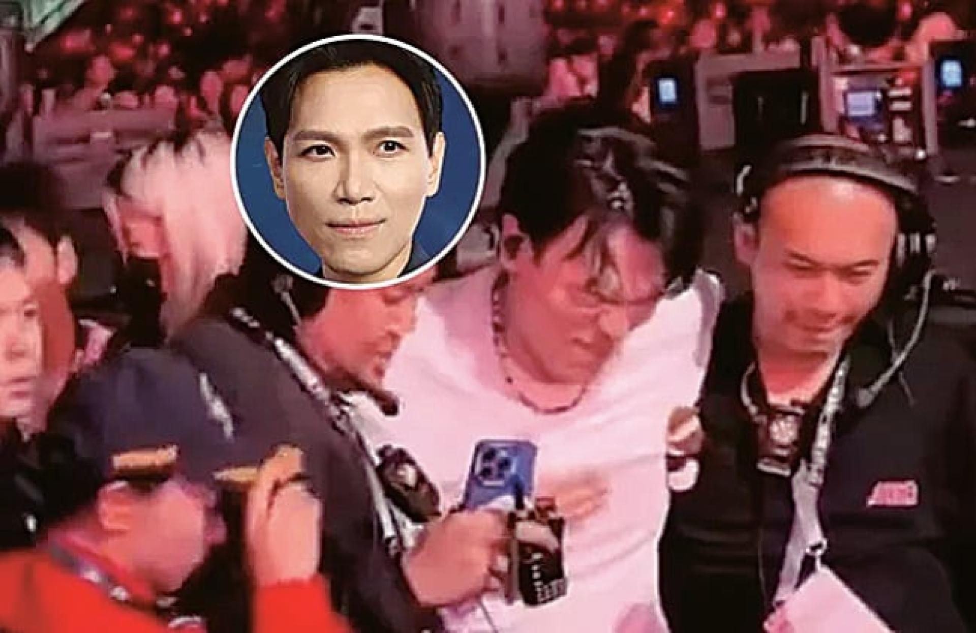 杨宗纬日前在演唱会摔下2米高舞台，被工作人员搀扶离开时表情痛苦。