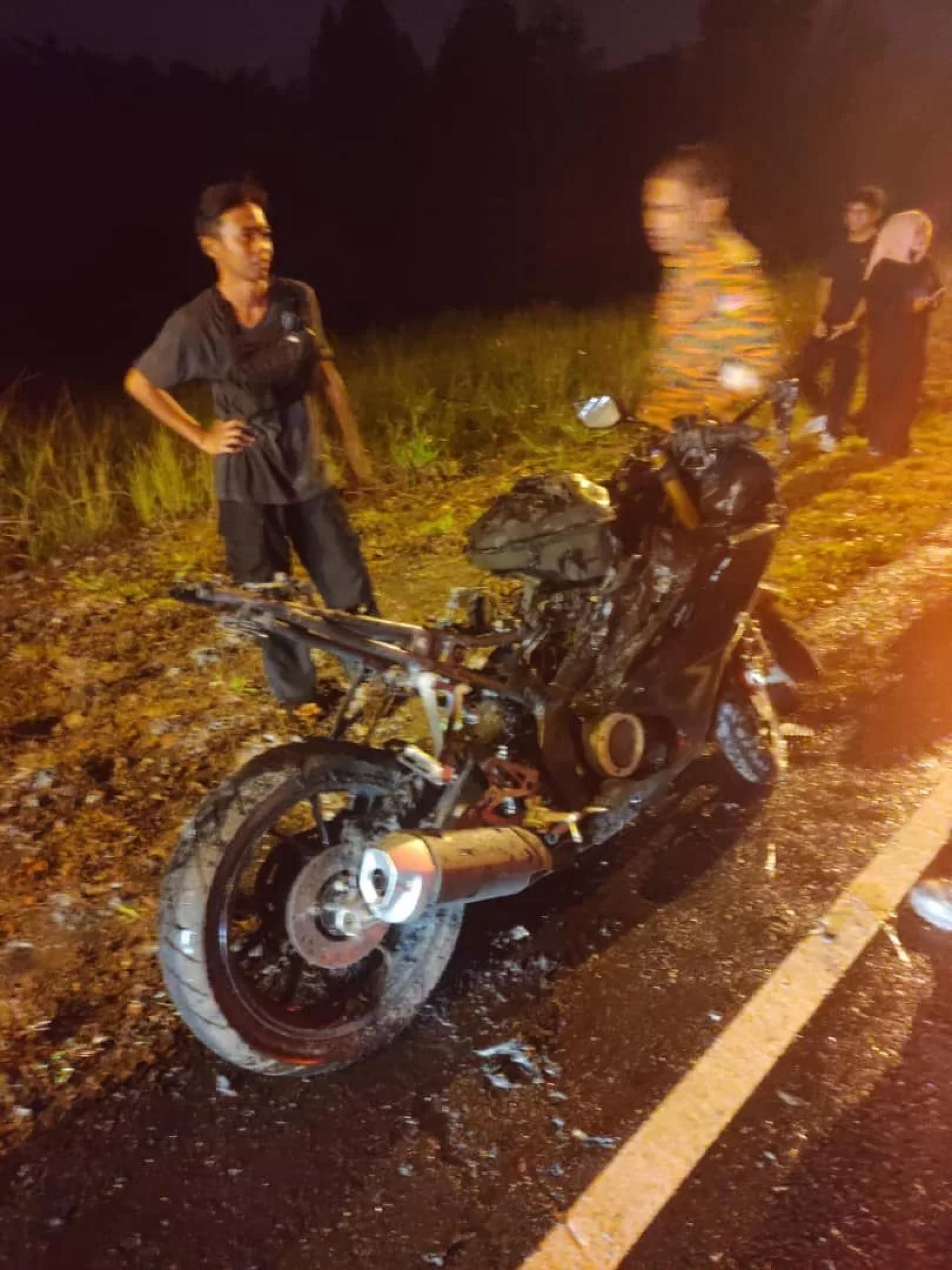 Handout photo shows the motorcycle completely destroyed after catching fire.