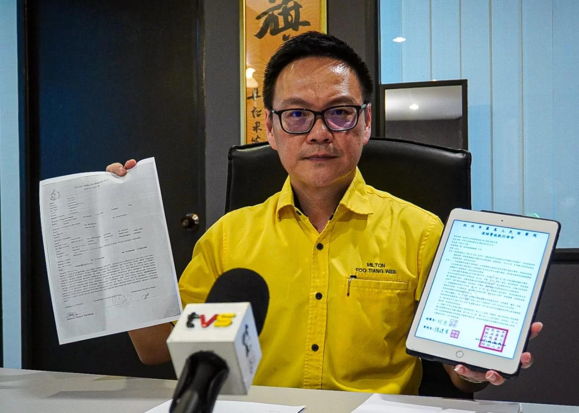 Foo shows the victim’s police report and the fake China court order.