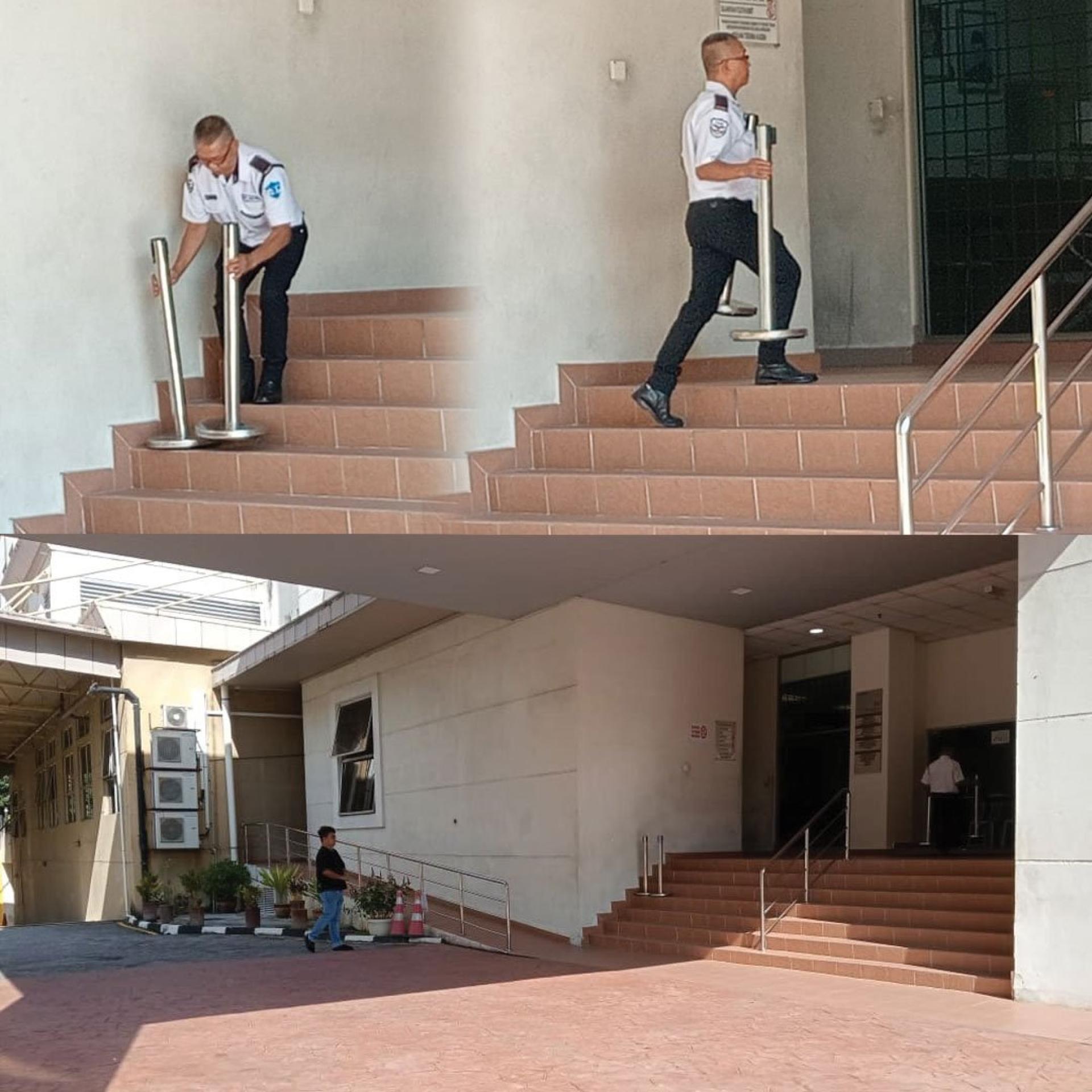 法庭保安于上午9时4分左右，收拾安全伸缩隔离带栏杆。