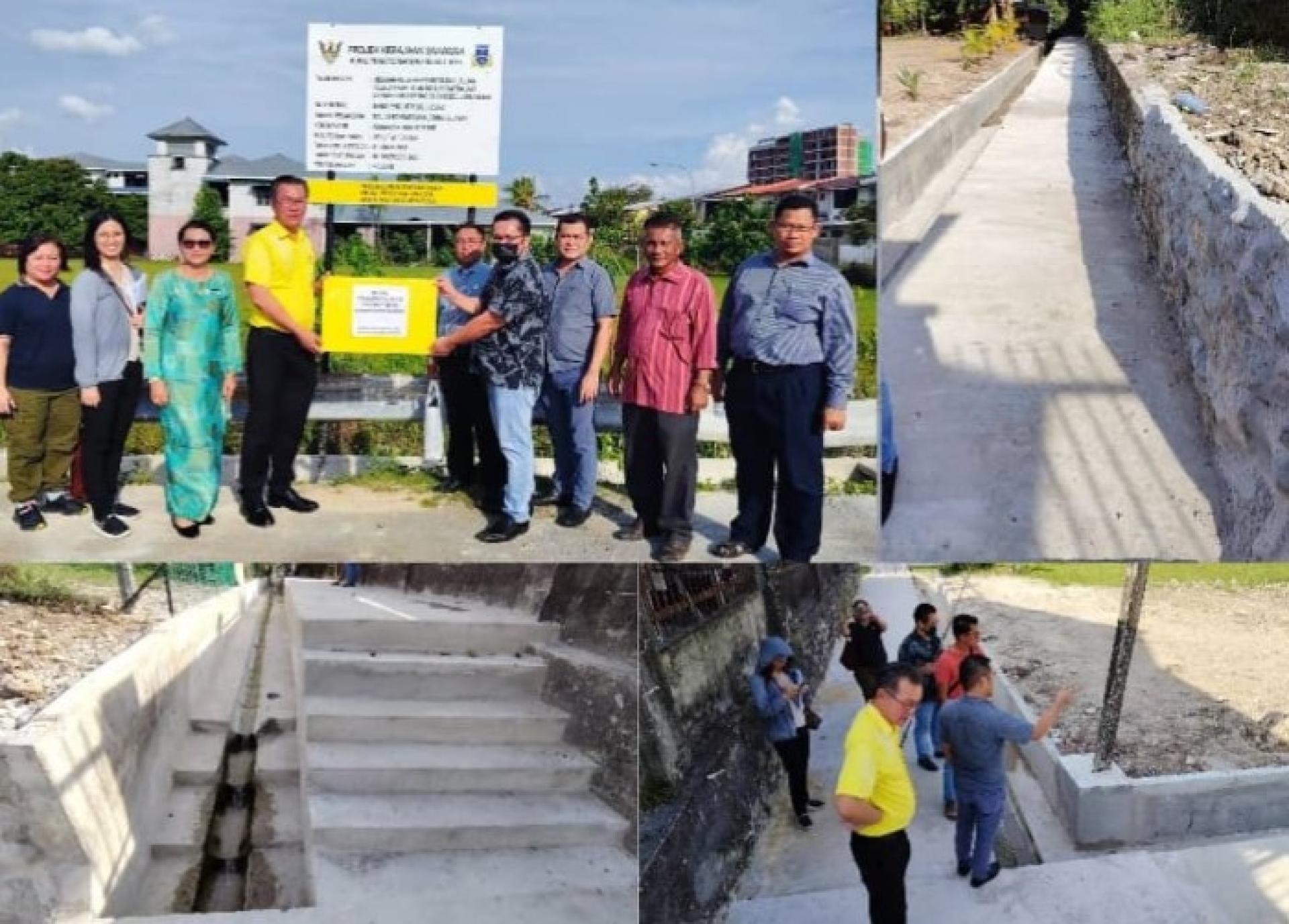 叶耀星（前右2）与古晋南市市政局官员一同见证由Permata Kukuh有限公司承建的RTP项目正式竣工。