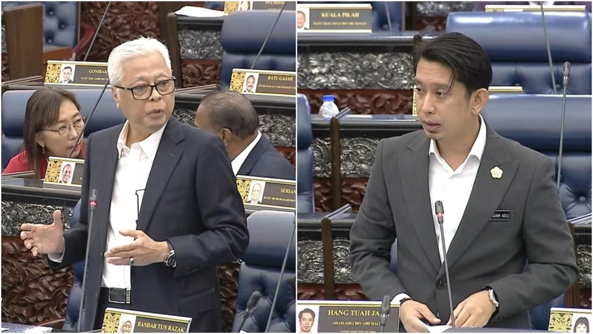 阿当阿里（右）今天在国会问答环节，回应依斯迈沙比里的询问。
