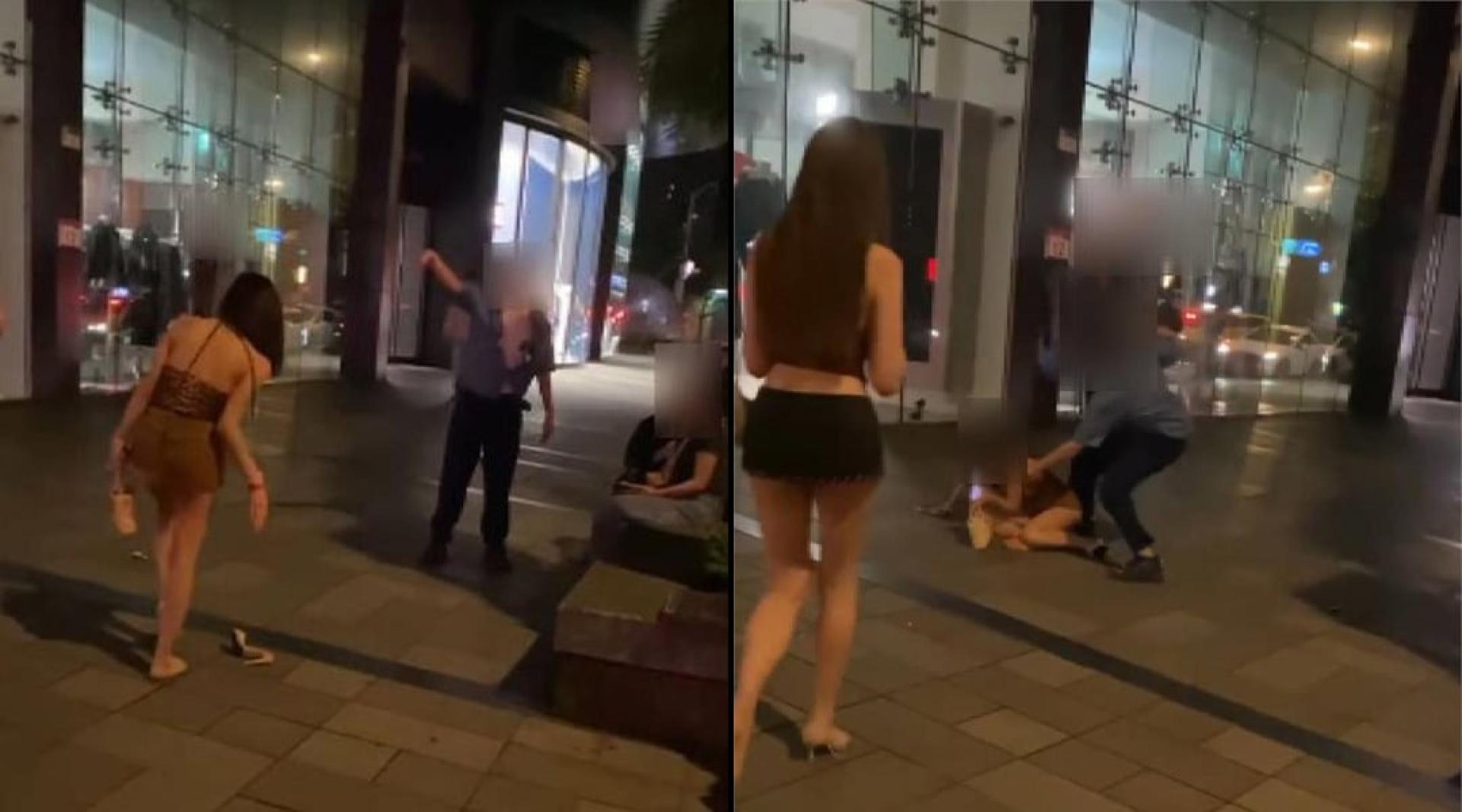 泰国变性人脱高跟鞋，持鞋追打陈男，陈男将对方打倒在地。