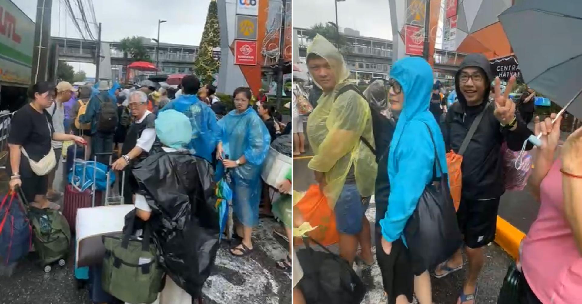 大马义务救援队今天抵达合艾救出受困国人；近下午2时之际，已经救出60名受困国人，有者还开心比胜利手势。