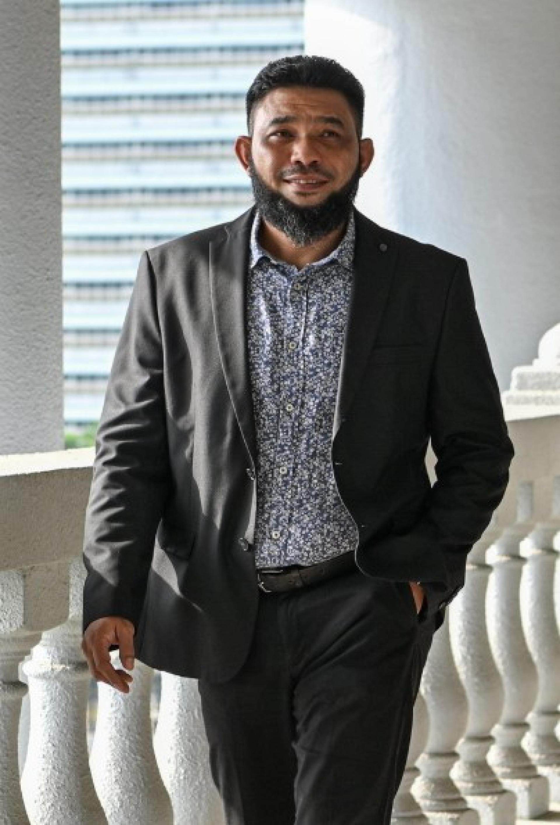 Papagomo因发布11名公正党国会议员撤回支持安华的假消息而被控，惟他不认罪。（档案照）