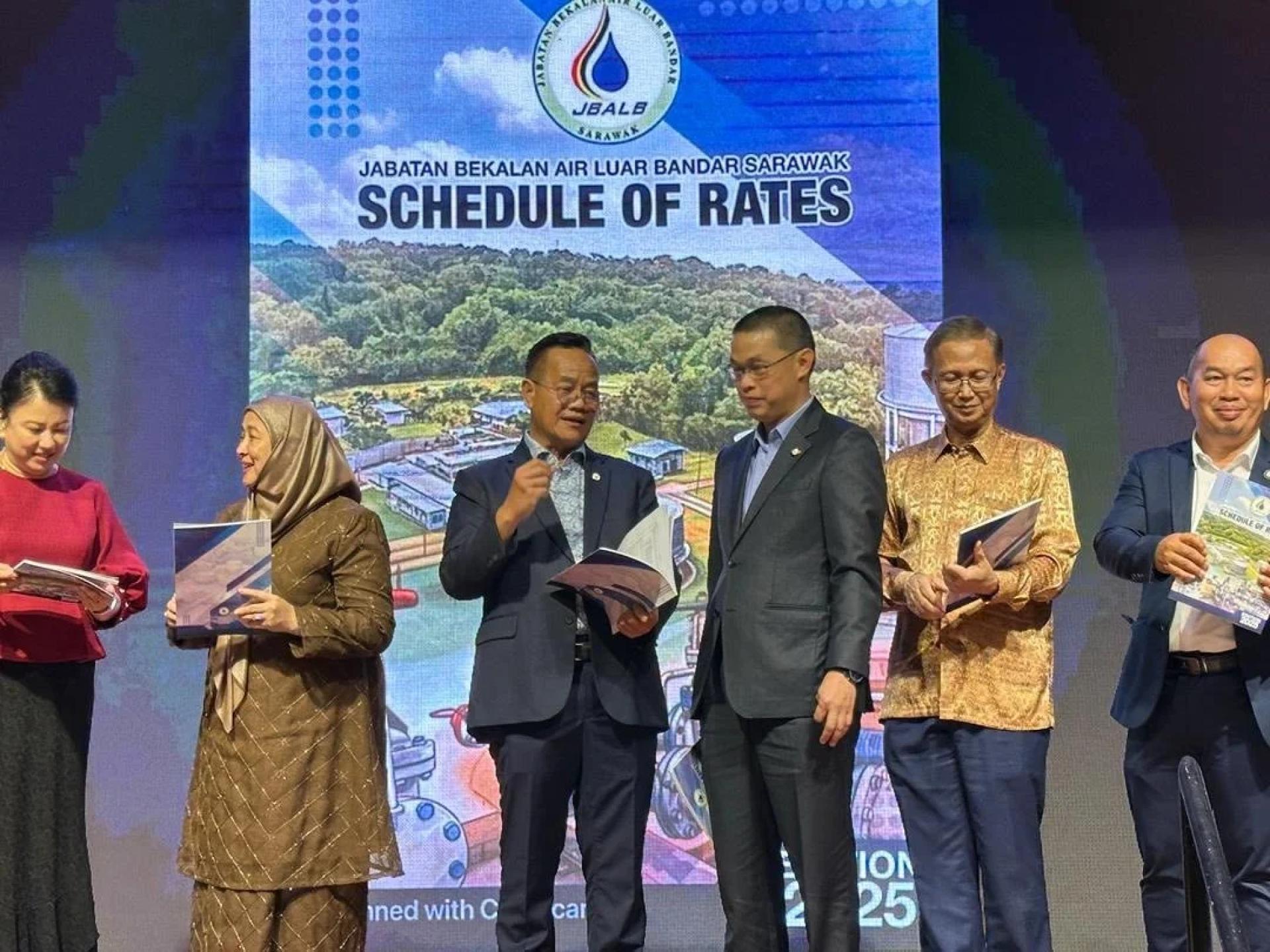 Liwan (third left) on stage with Awang Mohamad Fadillah (fourth left) in a conversation.