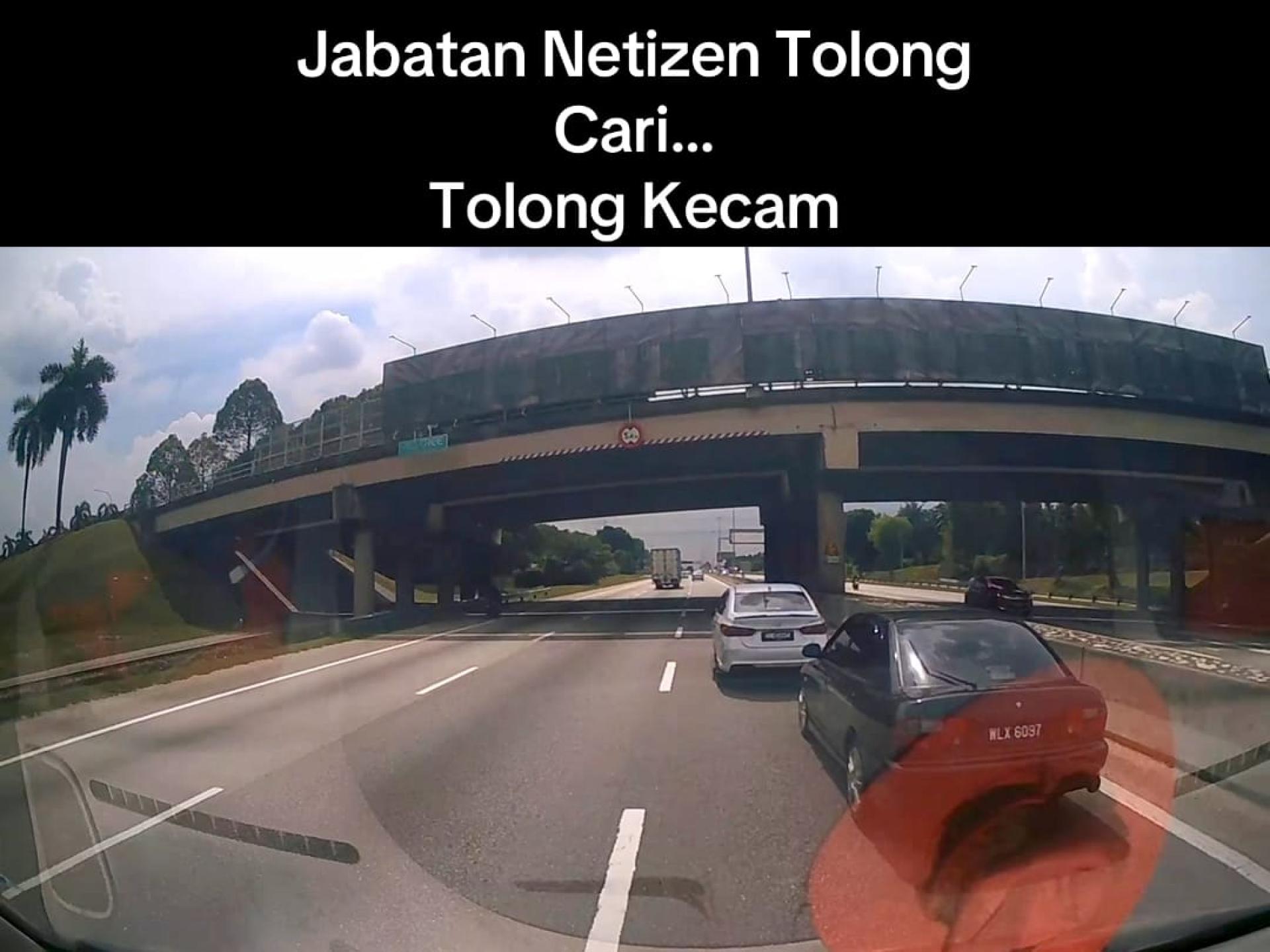 救护车司机在大道被迫越过未让路的两辆轿车。