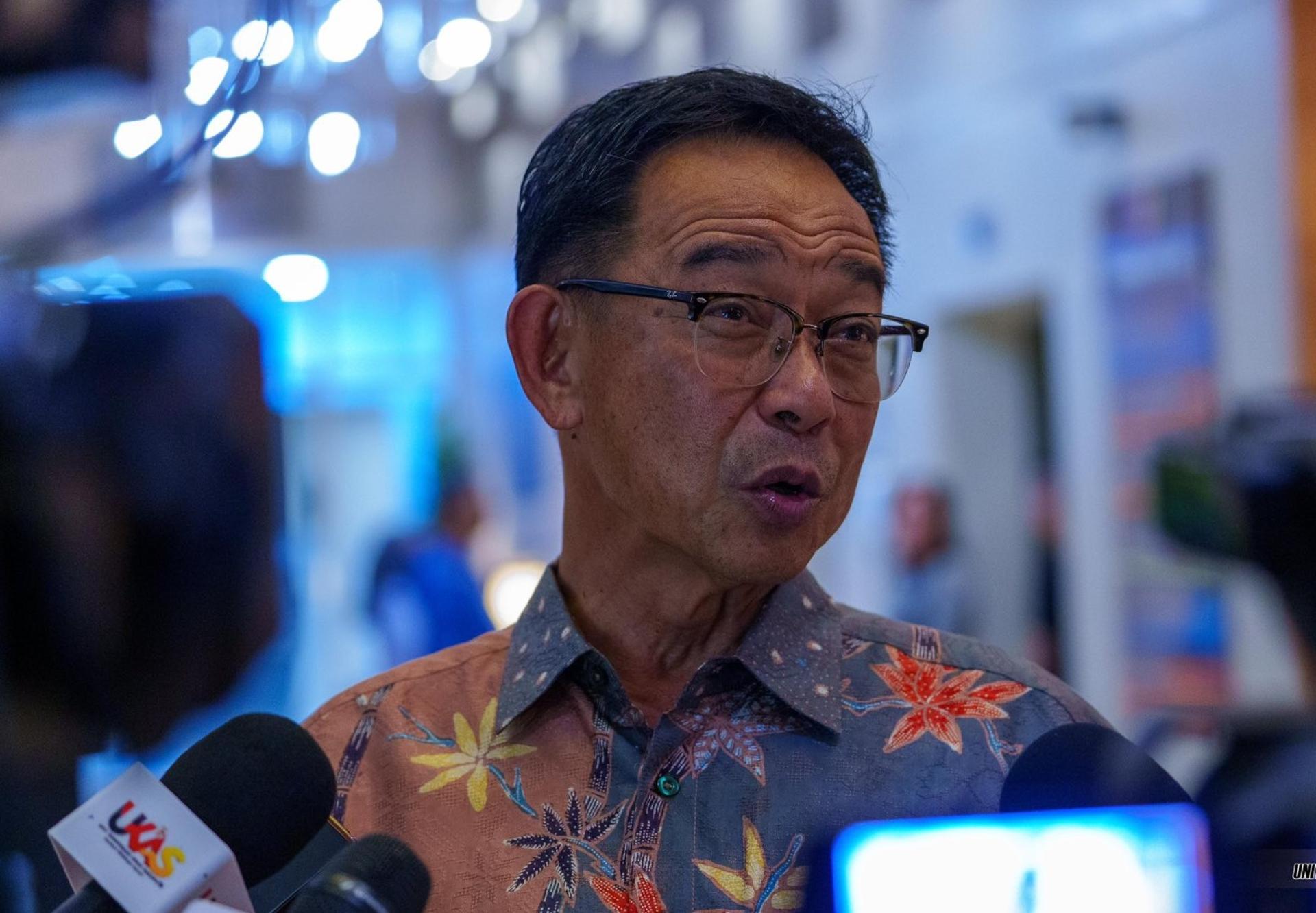 Abdul Karim speaks to the media on the sidelines of the event.