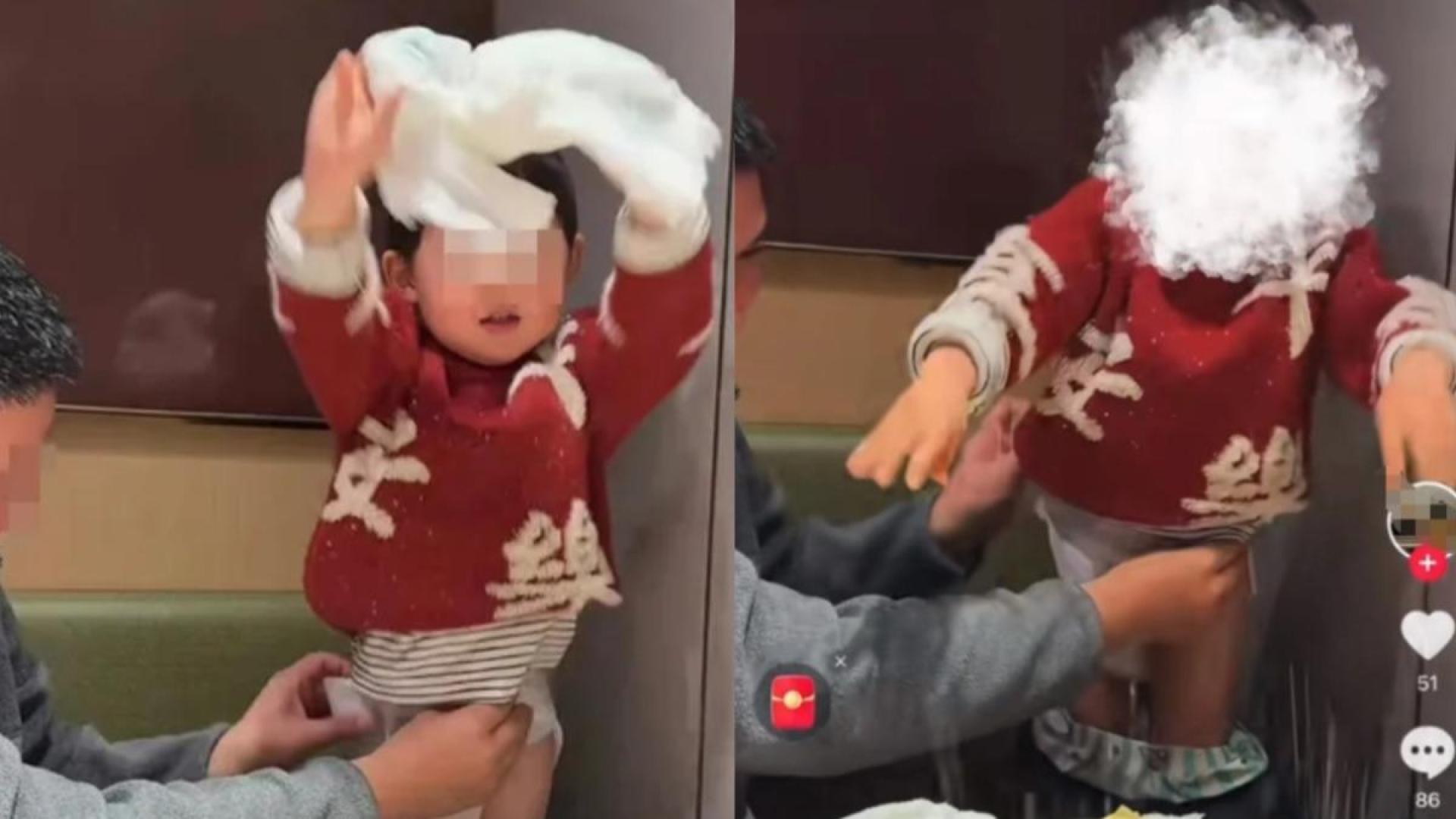 从视频所见，幼童高举尿布后，直接投入正在煮食的火锅中。