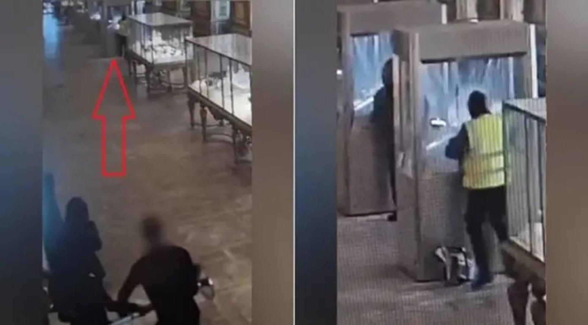 看著前方的劫匪，保安员似乎在犹豫如何应对。