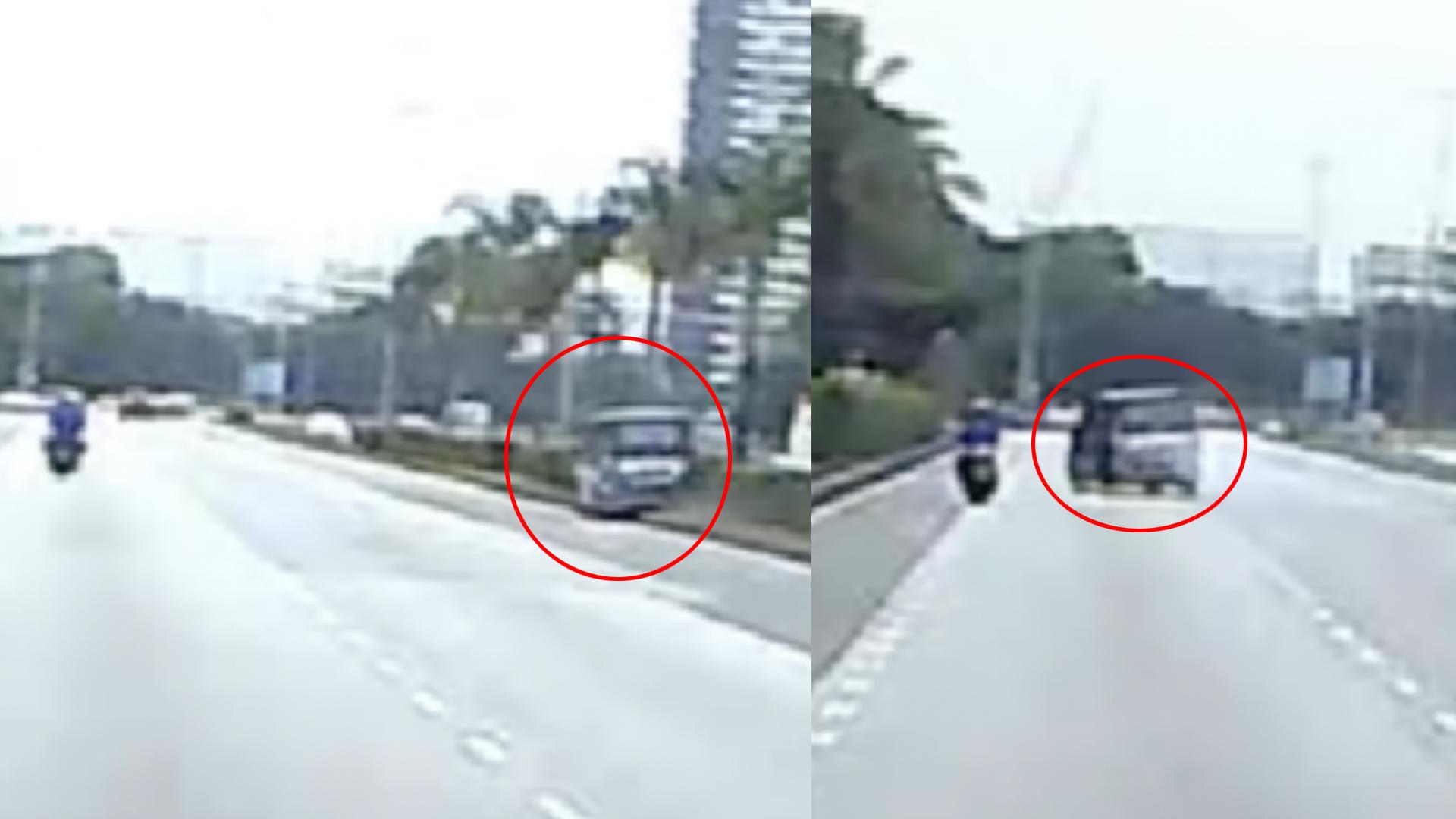 一辆轿车撞到了分界堤，失控斜冲撞向路边，还好路边的摩托车骑士紧急刹车，才没被这辆失控的轿车扫撞。