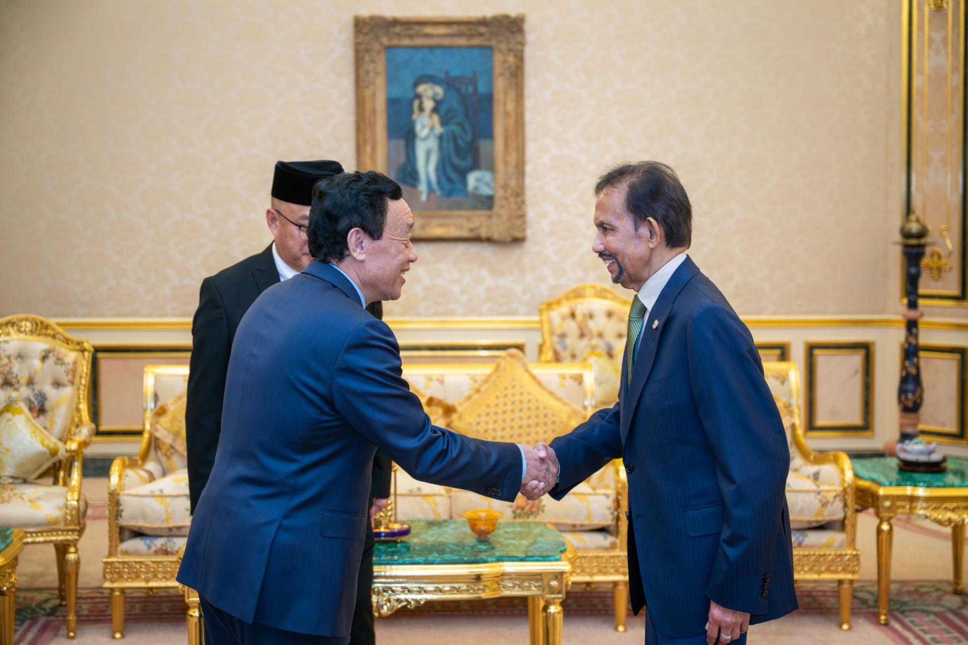 苏丹与联合国粮农组织总干事屈冬玉博士握手